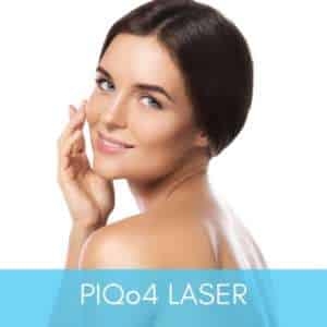 Woman smiling with balanced skin pigment after piqo4 treatment.