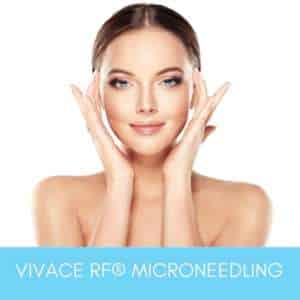 Woman smiling and touching her rejuvenated skin after Vivace Face RF Microneedling treatment at Sculpt DTLA.